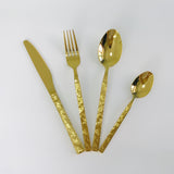 Shinning gold dinnerware with stone texture handles
