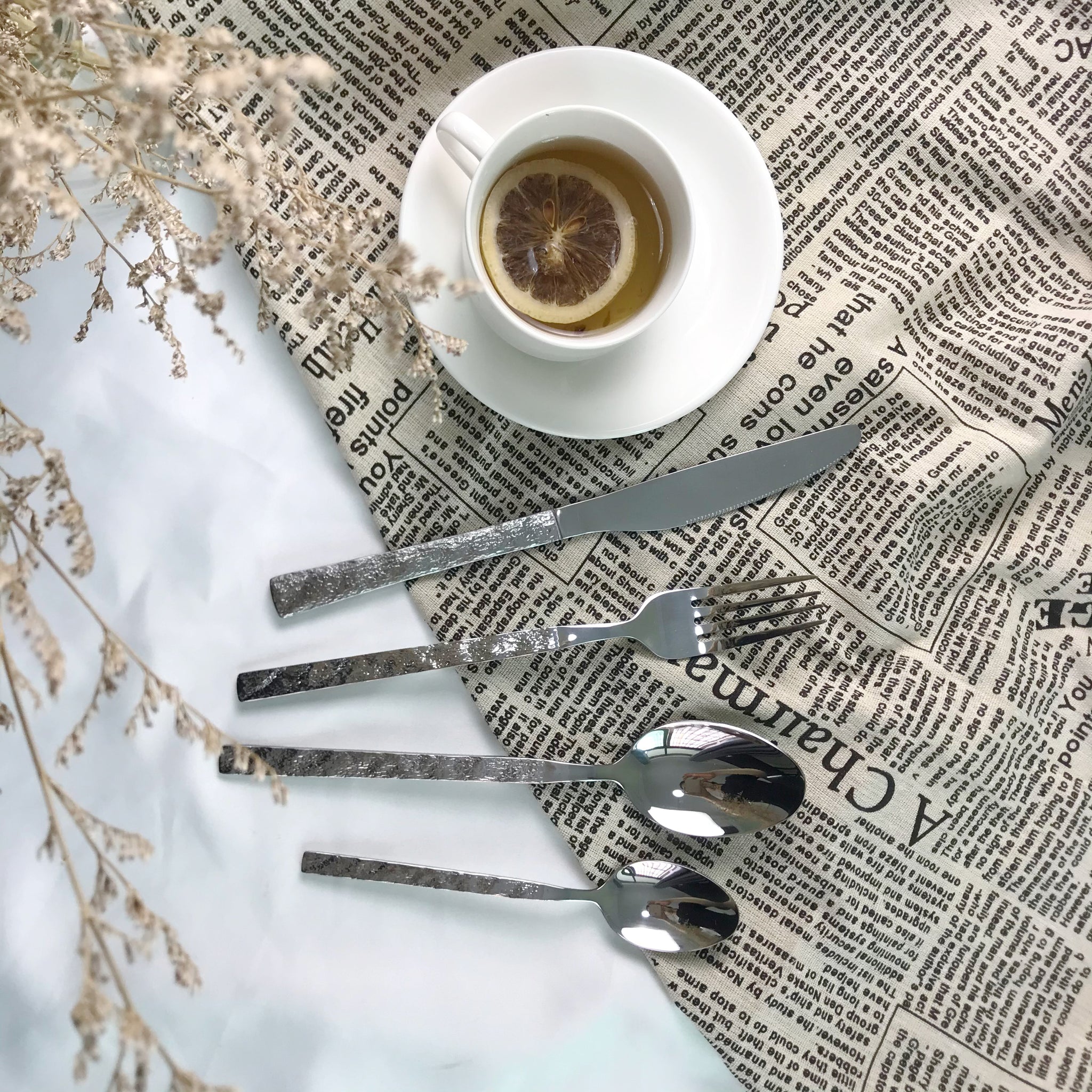 Flatware set with stone texture handle
