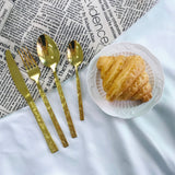 Shinning gold dinnerware with stone texture handles