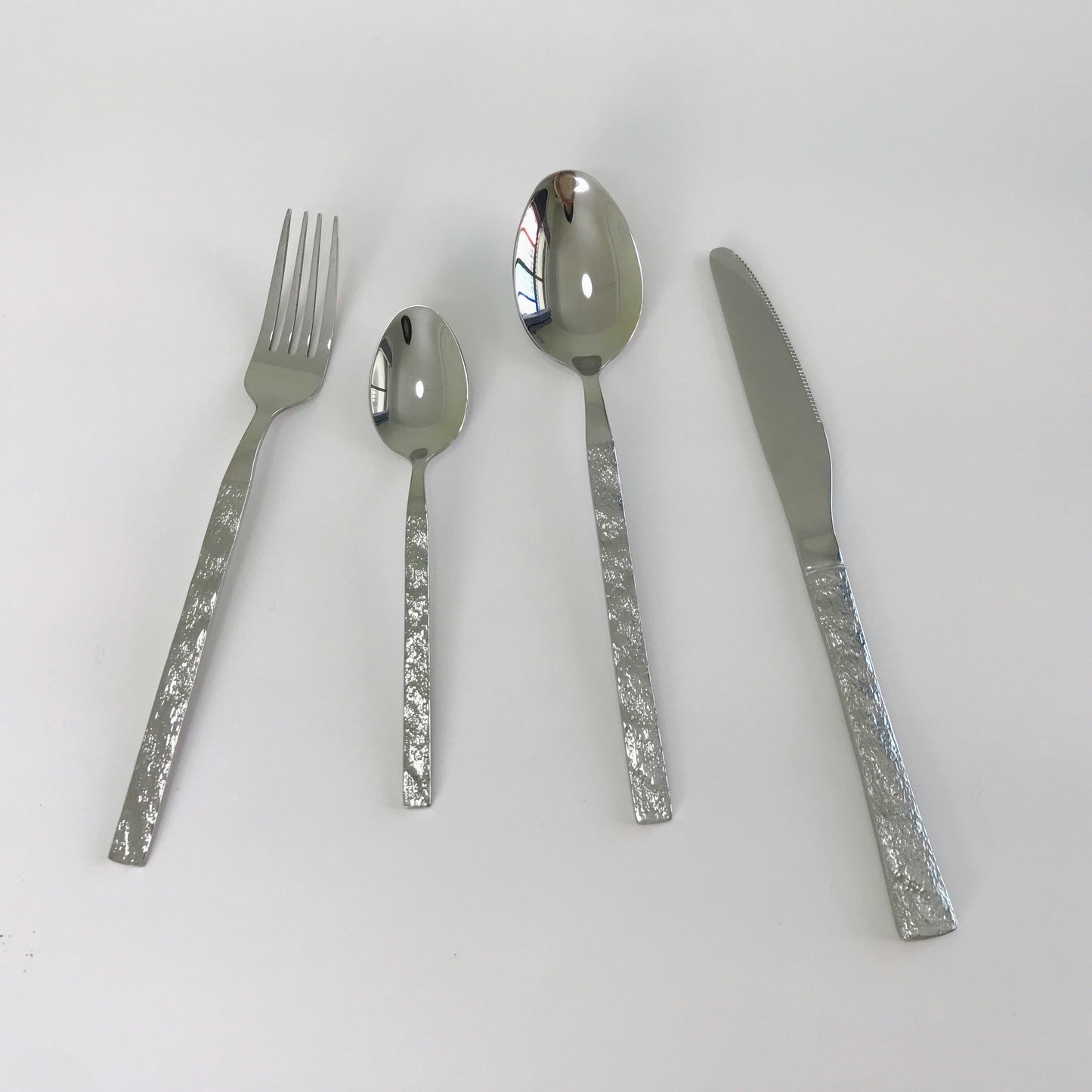 Flatware set with stone texture handle