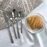 Flatware set with stone texture handle